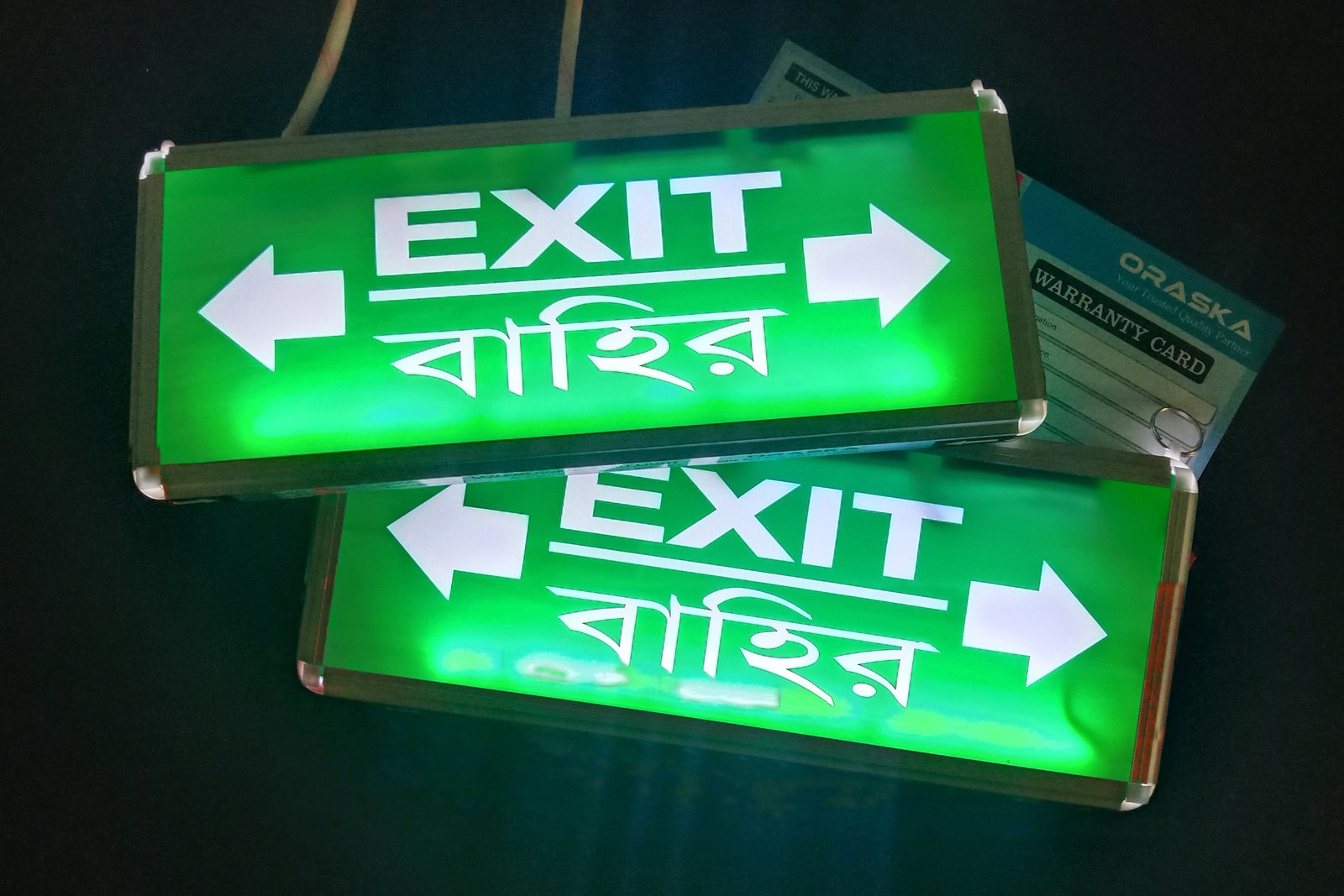 ORASKA Exit Sign Light SparkPro W-2616 – 14×6×1 inch Green-White Both-Directional Arrow, 7W, 500-550 LUX, 8.2V-2200mAH Li-Ion Battery, 3-4 Hr Backup, World’s Best Super Bright UL Standard